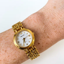 Load image into Gallery viewer, Vintage Ladies&#39; Ingersoll Quartz Watch with Intricate Gold-Tone Bracelet and White Dial
