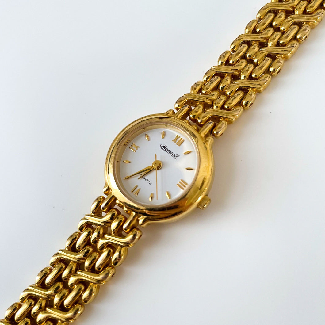 Vintage Ladies' Ingersoll Quartz Watch with Intricate Gold-Tone Bracelet and White Dial