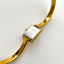 Load image into Gallery viewer, Vintage 90s Yves Saint Laurent Ladies&#39; Bangle Style Quartz Watch with Gold-Tone Bracelet and White Mother of Pearl Dial
