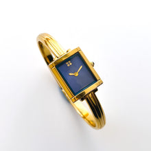 Load image into Gallery viewer, Vintage 90s Yves Saint Laurent Ladies&#39; Bangle Style Quartz Watch with Gold-Tone Bracelet and Metallic Blue Dial
