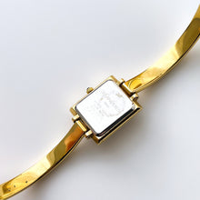 Load image into Gallery viewer, Vintage 90s Yves Saint Laurent Ladies&#39; Bangle Style Quartz Watch with Gold-Tone Bracelet and Metallic Blue Dial
