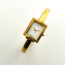 Load image into Gallery viewer, Vintage 90s Yves Saint Laurent Ladies&#39; Bangle Style Quartz Watch with Gold-Tone Bracelet and White Mother of Pearl Dial
