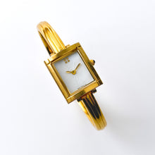 Load image into Gallery viewer, Vintage 90s Yves Saint Laurent Ladies&#39; Bangle Style Quartz Watch with Gold-Tone Bracelet and White Mother of Pearl Dial
