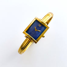 Load image into Gallery viewer, Vintage 90s Yves Saint Laurent Ladies&#39; Bangle Style Quartz Watch with Gold-Tone Bracelet and Metallic Blue Dial
