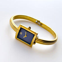 Load image into Gallery viewer, Vintage 90s Yves Saint Laurent Ladies&#39; Bangle Style Quartz Watch with Gold-Tone Bracelet and Metallic Blue Dial
