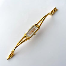 Load image into Gallery viewer, Vintage 1990s Gold-Plated Ladies&#39; Nina Ricci Bangle Quartz Watch with Rectangular Dial
