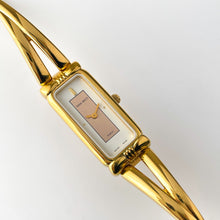 Load image into Gallery viewer, Vintage 1990s Gold-Plated Ladies&#39; Nina Ricci Bangle Quartz Watch with Rectangular Dial
