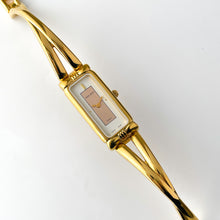 Load image into Gallery viewer, Vintage 1990s Gold-Plated Ladies&#39; Nina Ricci Bangle Quartz Watch with Rectangular Dial
