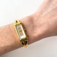 Load image into Gallery viewer, Vintage 1990s Gold-Plated Ladies&#39; Nina Ricci Bangle Quartz Watch with Rectangular Dial
