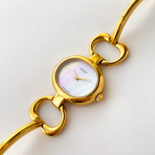 Load image into Gallery viewer, 1990s Gucci Quartz Watch with Mother of Pearl Dial and Semi Bangle Bracelet
