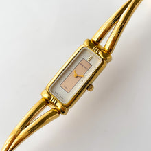 Load image into Gallery viewer, Vintage 1990s Gold-Plated Ladies&#39; Nina Ricci Bangle Quartz Watch with Rectangular Dial
