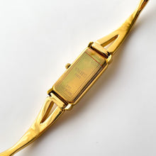 Load image into Gallery viewer, Vintage 1990s Gold-Plated Ladies&#39; Nina Ricci Bangle Quartz Watch with Rectangular Dial
