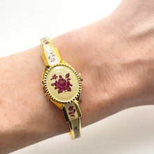 Load image into Gallery viewer, Vintage André Mouche Quartz Watch with Pearl and Burgundy Enamel Floral Design, Concealed Dial and Gold-Plated Bangle Bracelet
