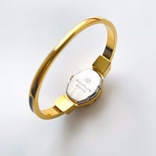 Load image into Gallery viewer, Vintage André Mouche Quartz Watch with Navy Enamel Floral Design, Concealead Dial and Gold-Plated Bangle Bracelet
