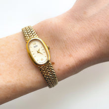 Load image into Gallery viewer, 1990s Ladies&#39; Gold-Tone Seiko Quartz Watch with Oval Dial and Integrated Bracelet
