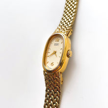 Load image into Gallery viewer, 1990s Ladies&#39; Gold-Tone Seiko Quartz Watch with Oval Dial and Integrated Bracelet
