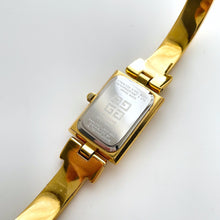 Load image into Gallery viewer, Vintage 1990s Gold-Plated Ladies&#39; Givenchy Bangle Watch with Blue Dial and Quartz Movement
