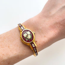 Load image into Gallery viewer, Vintage André Mouche Quartz Watch with Burgundy Enamel Floral Design, Concealead Dial and Gold-Plated Bangle Bracelet
