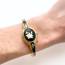 Load image into Gallery viewer, Vintage André Mouche Quartz Watch with Black Enamel Floral Design, Concealead Dial and Gold-Plated Bangle Bracelet
