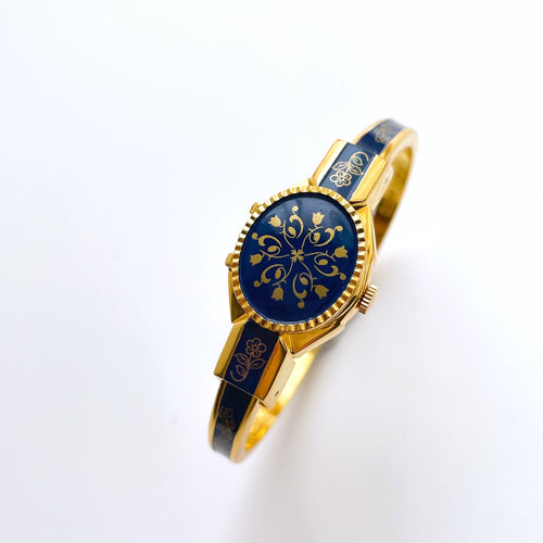 Vintage André Mouche Quartz Watch with Gold and Navy Enamel Floral Design, Concealead Dial and Gold-Plated Bangle Bracelet