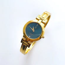 Load image into Gallery viewer, Vintage 1990s Gold-Plated Ladies&#39; Givenchy Bangle Watch with Blue Dial and Quartz Movement
