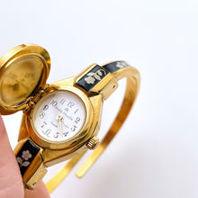 Load image into Gallery viewer, Vintage André Mouche Quartz Watch with Black Enamel Floral Design, Concealead Dial and Gold-Plated Bangle Bracelet
