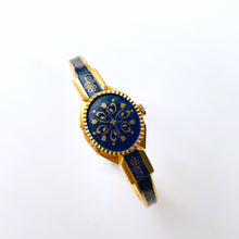 Load image into Gallery viewer, Vintage André Mouche Quartz Watch with Gold and Navy Enamel Floral Design, Concealead Dial and Gold-Plated Bangle Bracelet
