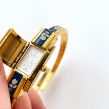 Load image into Gallery viewer, Vintage André Mouche Quartz Watch with Navy Enamel Floral Design, Concealead Dial and Gold-Plated Bangle Bracelet
