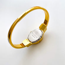 Load image into Gallery viewer, Vintage André Mouche Quartz Watch with Enamel Floral Design, Concealead Dial and Gold-Plated Bangle Bracelet
