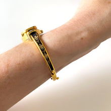 Load image into Gallery viewer, Vintage André Mouche Quartz Watch with Black Enamel Floral Design, Concealead Dial and Gold-Plated Bangle Bracelet
