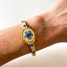 Load image into Gallery viewer, Vintage André Mouche Quartz Watch with Beige and Blue Enamel Floral Design, Concealead Dial and Gold-Plated Bangle Bracelet
