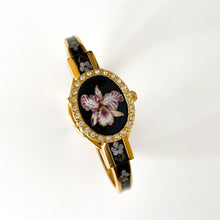 Load image into Gallery viewer, Vintage André Mouche Quartz Watch with Black and Purple Enamel Floral Design, Concealead Dial and Gold-Plated Bangle Bracelet
