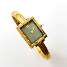 Load image into Gallery viewer, Vintage 90s Yves Saint Laurent Ladies&#39; Bangle Style Quartz Watch with Gold-Tone Bracelet and Green Dial
