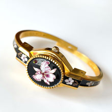 Load image into Gallery viewer, Vintage André Mouche Quartz Watch with Black and Purple Enamel Floral Design, Concealead Dial and Gold-Plated Bangle Bracelet
