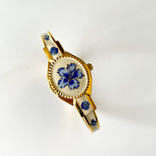 Load image into Gallery viewer, Vintage André Mouche Quartz Watch with Beige and Blue Enamel Floral Design, Concealead Dial and Gold-Plated Bangle Bracelet
