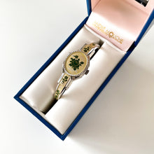 Load image into Gallery viewer, Vintage André Mouche Quartz Watch with Pink Enamel Floral Design, Concealead Dial and Silver Tone Bangle Bracelet
