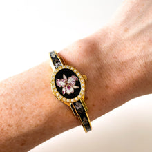 Load image into Gallery viewer, Vintage André Mouche Quartz Watch with Black and Purple Enamel Floral Design, Concealead Dial and Gold-Plated Bangle Bracelet
