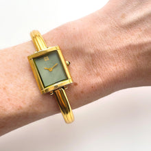 Load image into Gallery viewer, Vintage 90s Yves Saint Laurent Ladies&#39; Bangle Style Quartz Watch with Gold-Tone Bracelet and Green Dial
