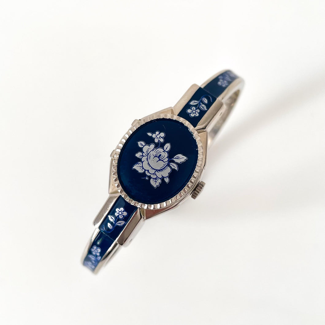 Vintage André Mouche Quartz Watch with Navy Enamel Floral Design, Concealead Dial and Silver-Tone Bangle Bracelet