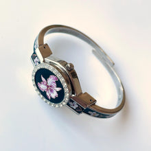 Load image into Gallery viewer, Vintage André Mouche Quartz Watch with Black Enamel Floral Design, Concealead Dial and Silver-Tone Bangle Bracelet
