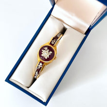 Load image into Gallery viewer, Vintage André Mouche Quartz Watch with Burgundy Enamel Floral Design, Concealead Dial and Gold-Plated Bangle Bracelet
