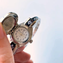 Load image into Gallery viewer, Vintage André Mouche Quartz Watch with Black Enamel Floral Design, Concealead Dial and Silver-Tone Bangle Bracelet
