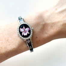 Load image into Gallery viewer, Vintage André Mouche Quartz Watch with Black Enamel Floral Design, Concealead Dial and Silver-Tone Bangle Bracelet
