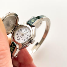 Load image into Gallery viewer, Vintage André Mouche Quartz Watch with Green Enamel Floral Design, Concealead Dial and Silver-Tone Bangle Bracelet
