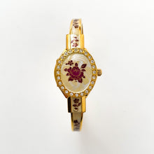 Load image into Gallery viewer, Vintage André Mouche Quartz Watch with Enamel Floral Design, Concealed Dial and Gold-Plated Bangle Bracelet
