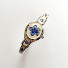 Load image into Gallery viewer, Vintage André Mouche Quartz Watch with Beige and Blue Enamel Floral Design, Concealed Dial and Stainless Steel Bangle Bracelet
