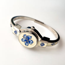 Load image into Gallery viewer, Vintage André Mouche Quartz Watch with Beige and Blue Enamel Floral Design, Concealed Dial and Stainless Steel Bangle Bracelet
