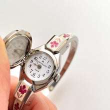 Load image into Gallery viewer, Vintage 1999 André Mouche Quartz Watch with Pink Enamel Floral Design, Concealed Dial and Silver-Tone Bangle Bracelet
