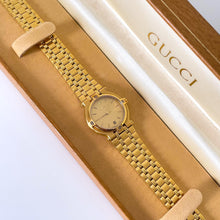 Load image into Gallery viewer, Vintage Gold-Plated Gucci Quartz Watch with Round Dial and Date Window
