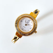 Load image into Gallery viewer, Vintage André Mouche Quartz Watch Set with Interchangeable Bezel, Enamel Design and Gold-Plated Bangle Bracelet
